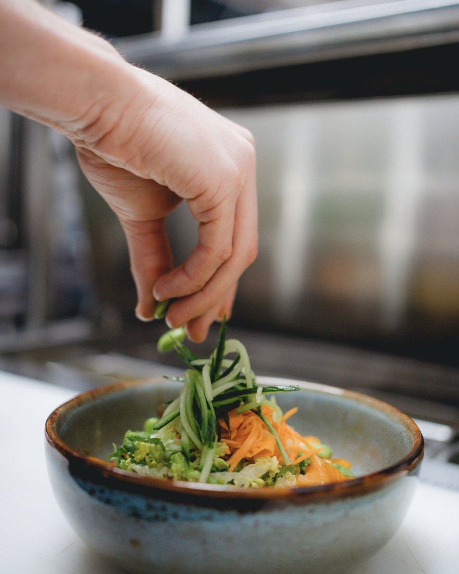 Fresh salmon poke bowl with avocado and crispy vegetables in Montreal restaurant