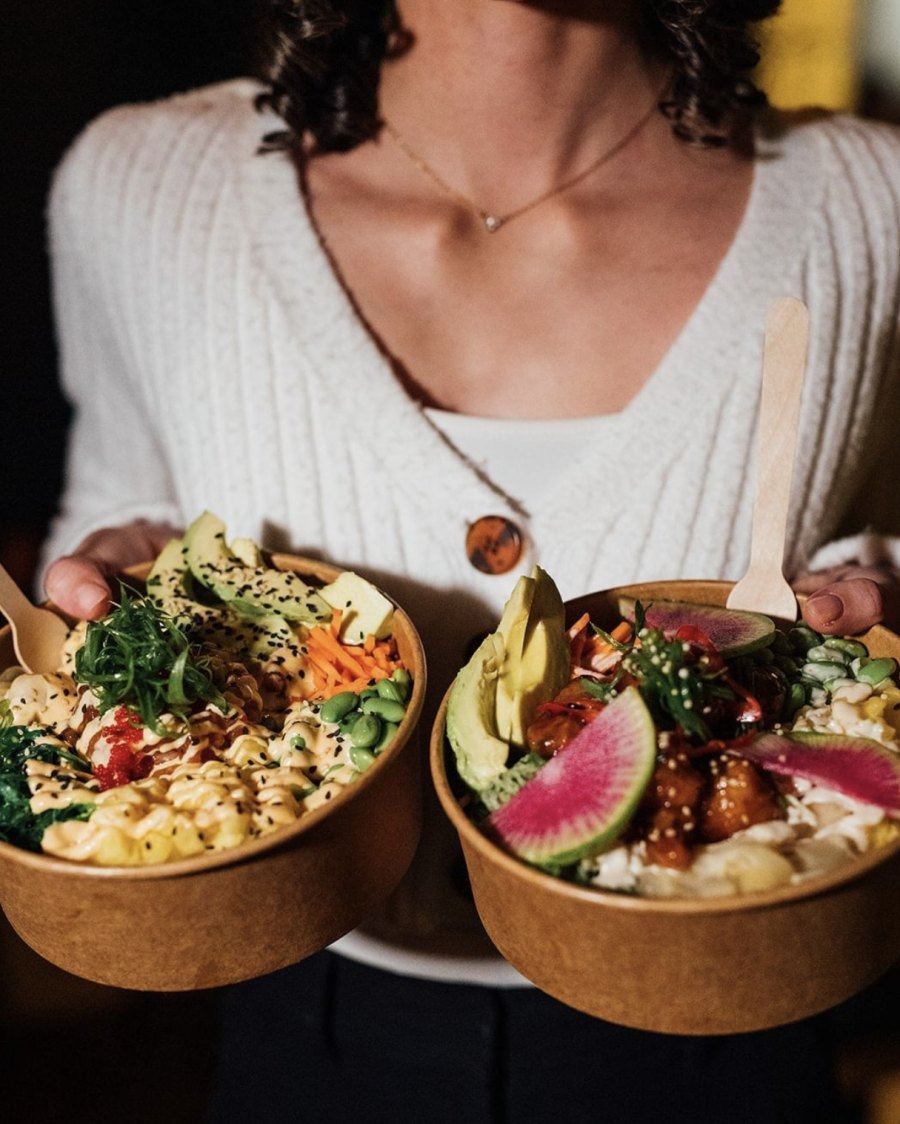 Fresh salmon poke bowl with avocado and crispy vegetables in Montreal restaurant