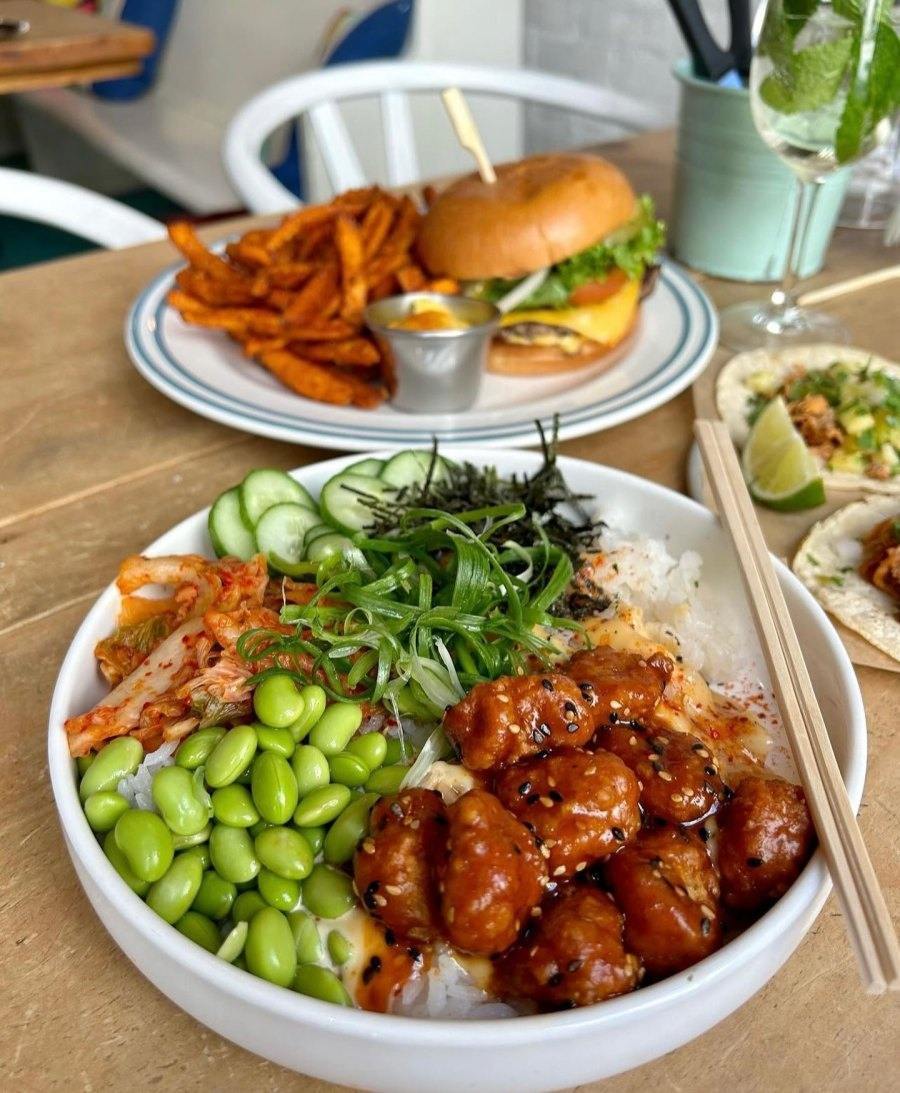Chef preparing poke bowl in open kitchen counter at Montreal restaurant