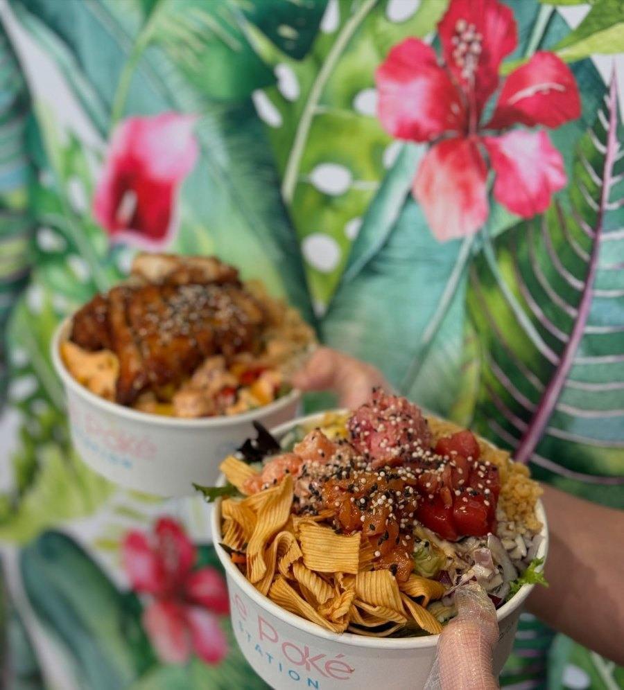 Chef preparing poke bowl in open kitchen counter at Montreal restaurant